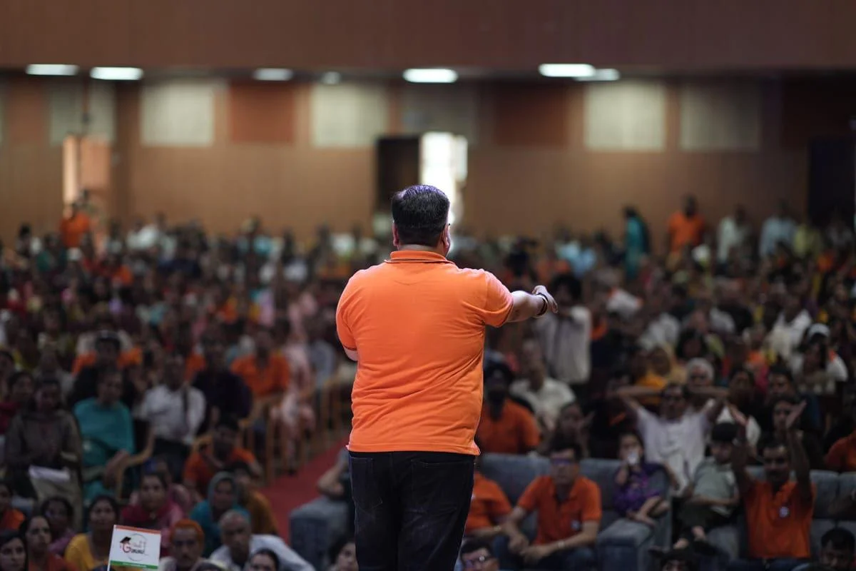 Mukesh Sinduria speaking to a large audience